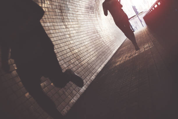 istock Silhouette of running athletes in tunnel 669478002