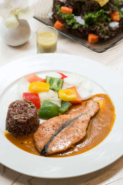 istock Salmon steak with rice berry and salad 669478154