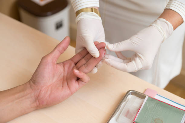 istock Close up of nurse hands doing blood testing 669480382