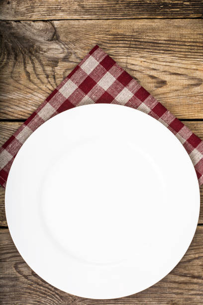 istock White plate and napkin Serving linen, menu 669483446
