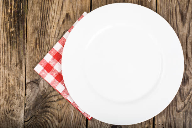 istock White plate and napkin Serving linen, menu 669483476