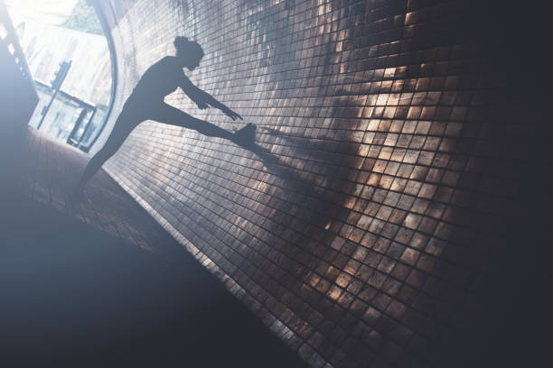 istock Silhouette of woman doing warming in tunnel 669483994