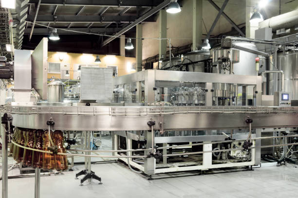 istock The filling machine pours beer into plastic PET bottles 669491680