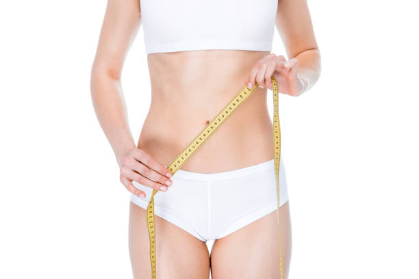istock Woman with measuring tape 669491736