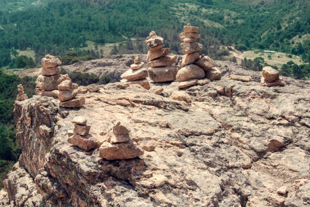 Piles of stones (cairn) on the top of a moutain, which are used for tracking.