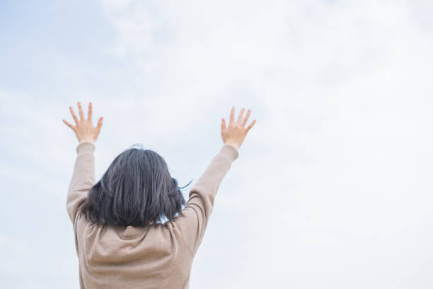 istock Woman and blue sky 669498390