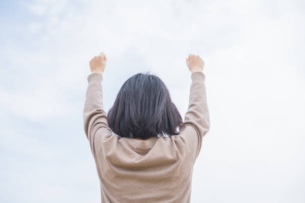 istock Woman and blue sky 669498624