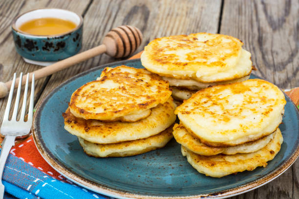 istock Pancakes on plate and honey in small bowl 669499102