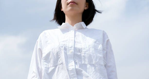 istock White shirt woman and blue sky 669499120