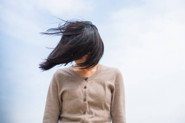 Black hair in the wind.