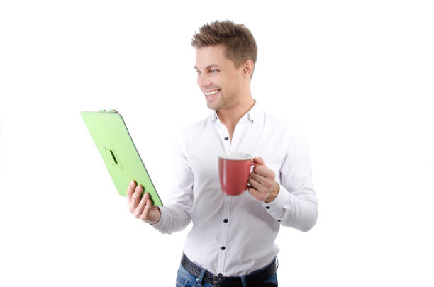 Man with a green tablet. Happy young guy. Sexy attractive guy. Isolated background. Beauty and joy. Concepts. vlad model photos stock pictures, royalty-free photos & images