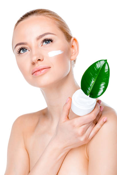 istock woman with green leaf 669502576