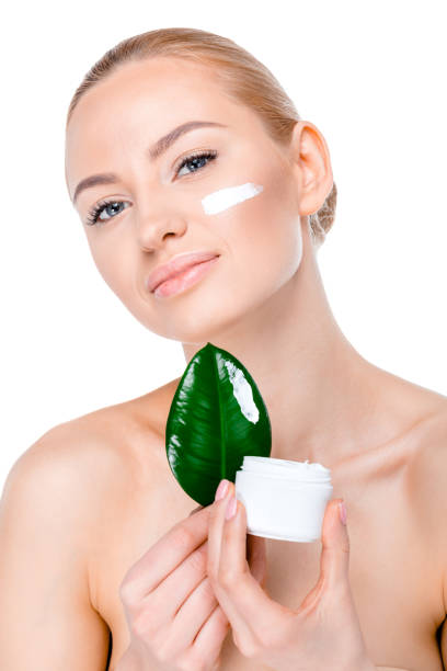 istock woman with green leaf 669502990