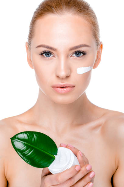 istock woman with green leaf 669506210