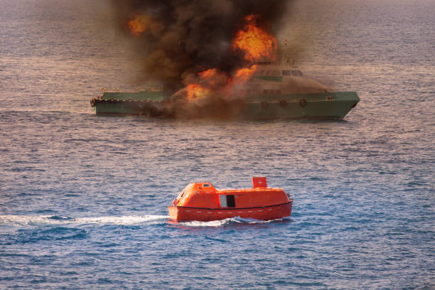 istock rescue boat performed demobilization passenger from supply boat because fire or worst case, Marine control contacting to rescue team or fire fighter team to help crews boat out of the bad location. 669506392