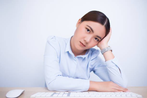 istock Woman has head pain from work 669506612