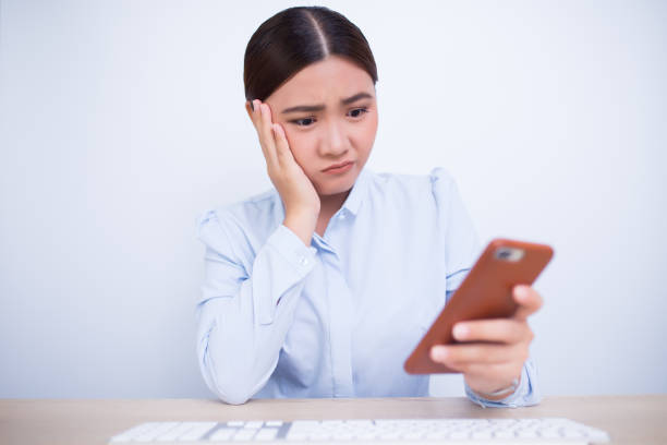istock Woman use the smartphone and she feel boring 669509706