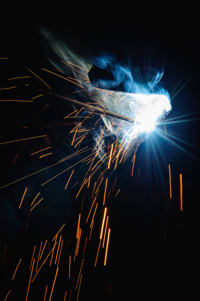 istock Welding steel structures and bright sparks with len flare in steel construction industry. 669512478