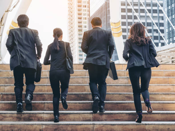 istock Group of Business People Running in Row 669512610