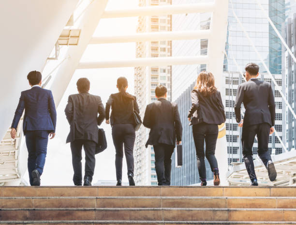 istock Group of Business People Running in Row 669512626
