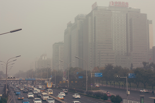24 October,2014 - Beijing China. Air pollution in Beijing China city center,countless cars stuck on the road,the building beides are Sinopec(the China Petroleum and Chemical Corporation) and a bank