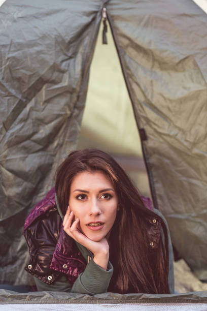istock Woman laying in opened tent 669515888