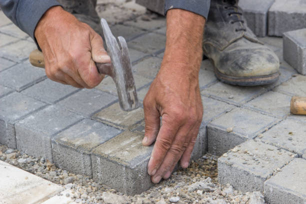 istock laying concrete brick pavers 2 669516290