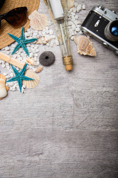 istock Travel and vacation items on wooden table 669526012