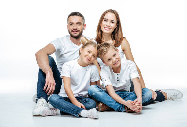 istock Happy family sitting together 669526022