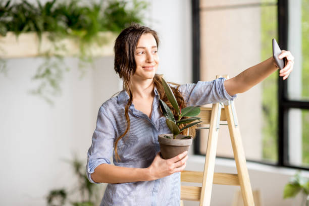 istock Woman with phone at home 669532910
