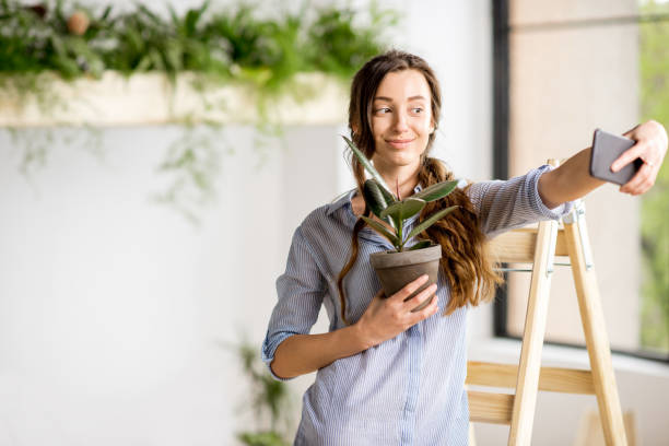 istock Woman with phone at home 669532984