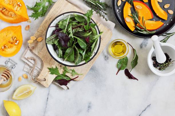 istock Ingredients for making roasted pumpkin salad with fresh herbs and lemon dressing 669533726