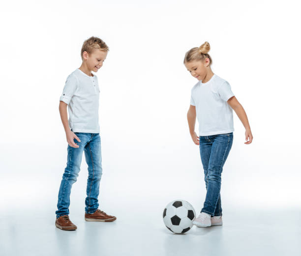 istock Smiling children playing with soccer ball 669533878