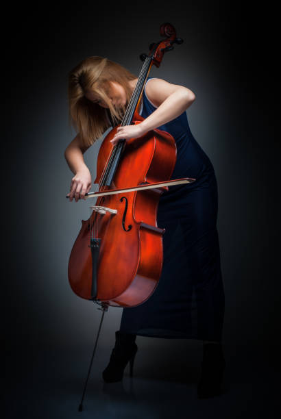 istock Female Cellist Playing Cello 669533988