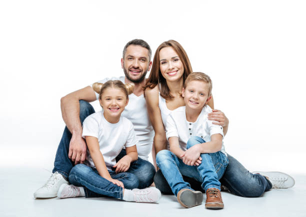 istock Happy family sitting together 669537858