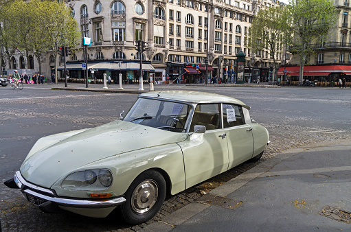 Paris: The legendary car Citroën DS on the Paris street. On the windows - the announcement of the sale.Paris: The legendary car Citroën DS on the Paris street. On the windows - the announcement of the sale.