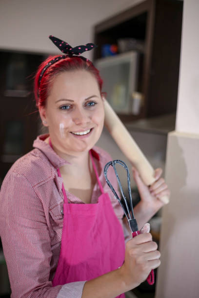 istock Woman whisking batter in kitchen 669540520