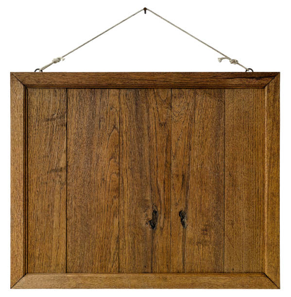 istock Old weathered worn natural wooden framed panel, hanging by old rope from a rusty nail, isolated on white, clipping path included. 669541410