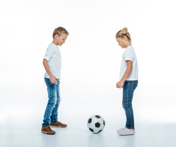 istock Smiling children playing with soccer ball 669541632
