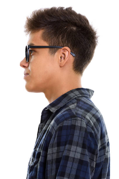 Close up profile view of young handsome man vertical shot
