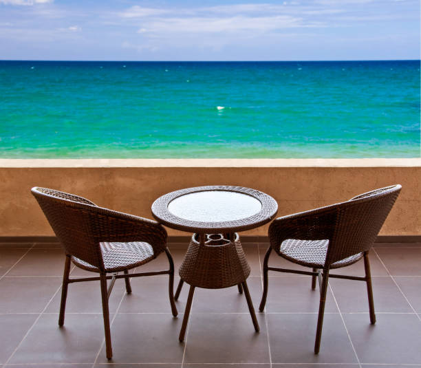 istock Table and chairs on a terrace, view on the ocean 669545546