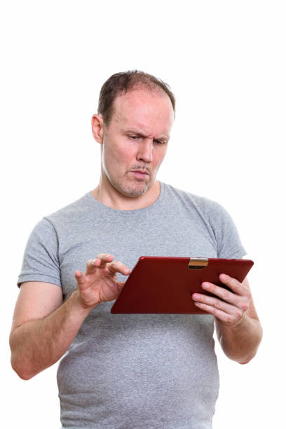 istock Studio shot of serious mature man using digital tablet 669551774