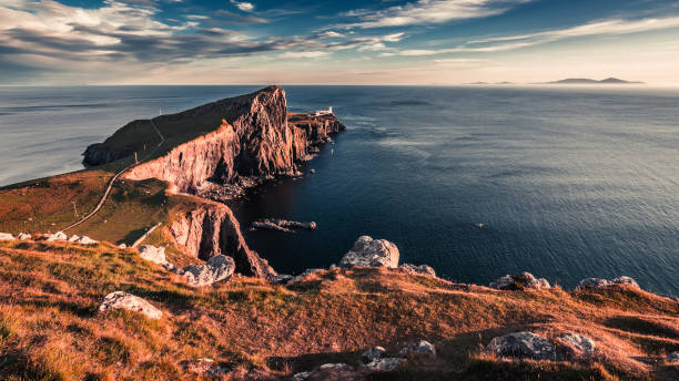 istock Breathtaking sunset at the Neist point lighthouse, Scotland, UK 669551938