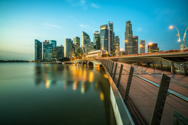 istock Singapore central business district skyline at blue hour 669555106