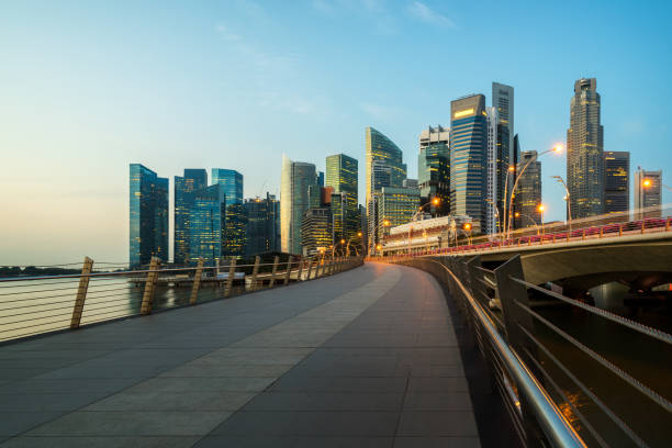 istock Singapore central business district skyline at blue hour 669555108
