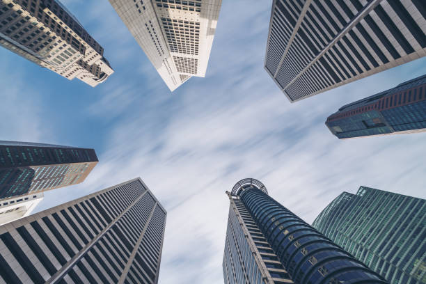 istock Business buildings skyline looking up with blue sky 669555154