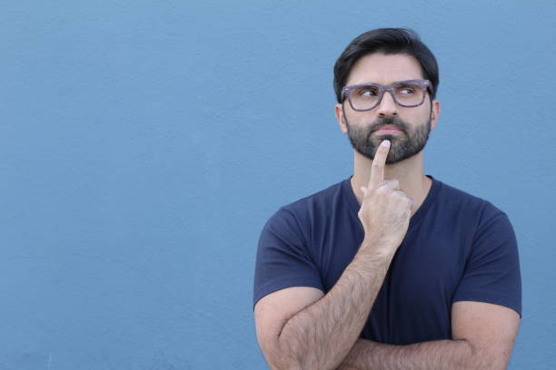 istock Young man doubting isolated over blue background 669558692