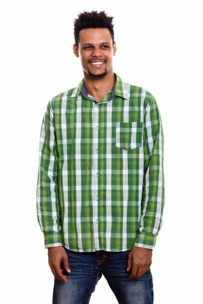 istock Studio shot of young happy African man smiling and standing while thinking 669558780