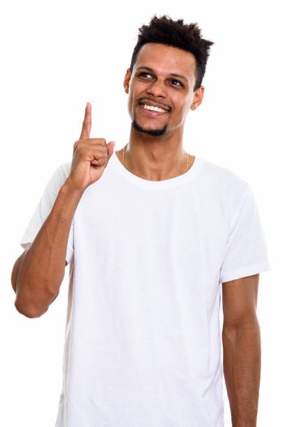 istock Studio shot of thoughtful young happy African man smiling while pointing finger up 669559724