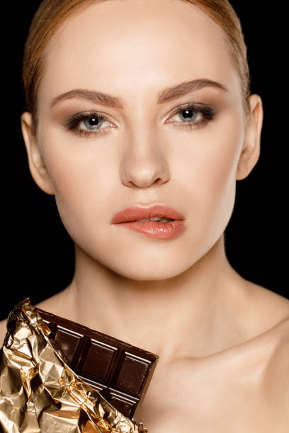 istock woman with chocolate bar 669566838